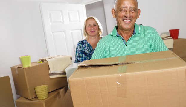 Happy-senior-couple-moving-into-their-new-home
